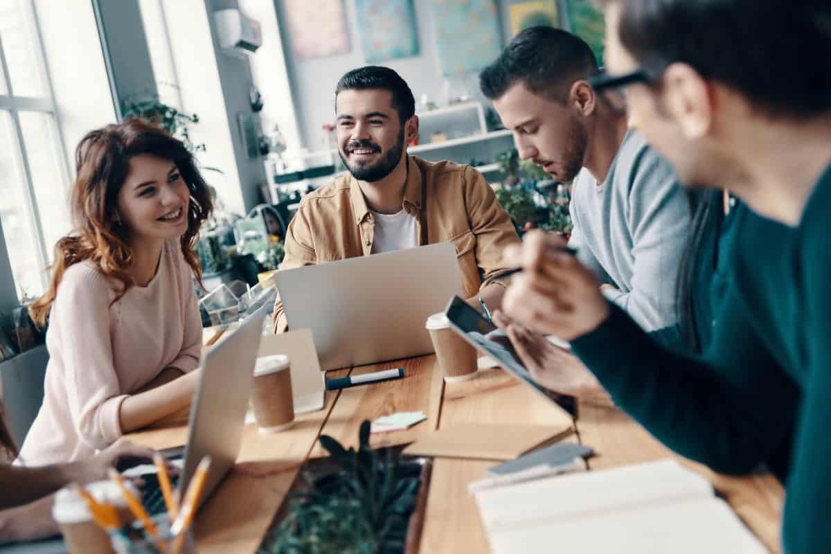 a group of people discussing over a table