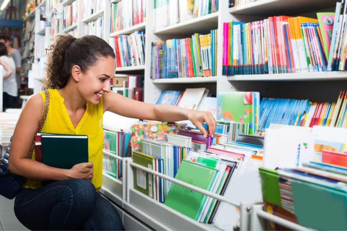 a woman buying a new book