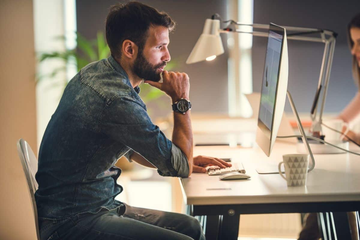 man focused on a mac