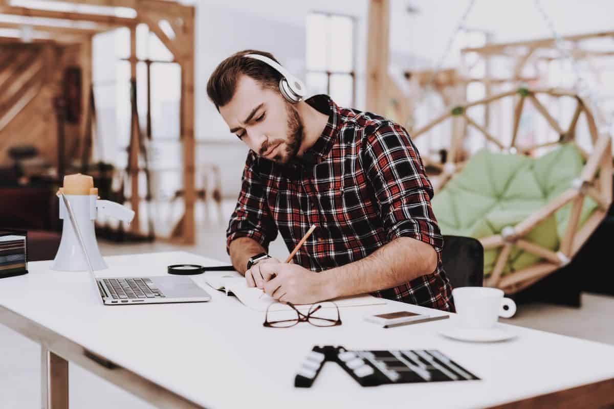 man listening to music while working