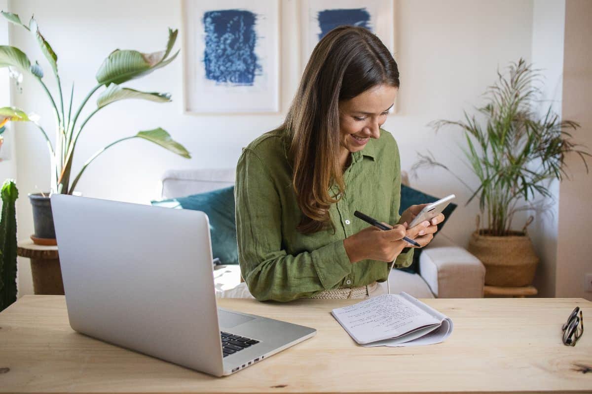 woman procrastinating on her phone