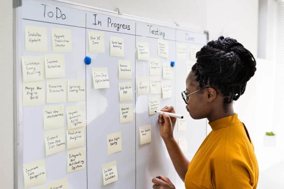 woman writing on a board