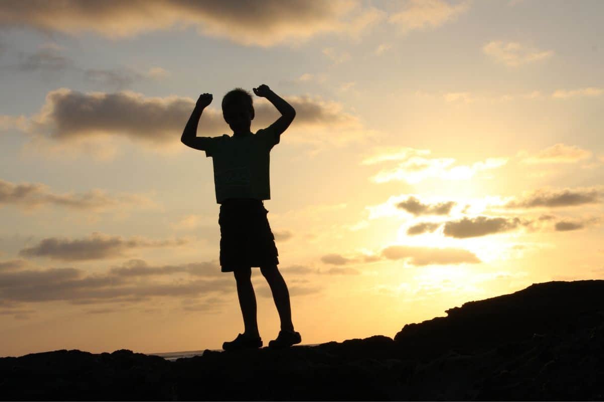 boys silhouette in sunset