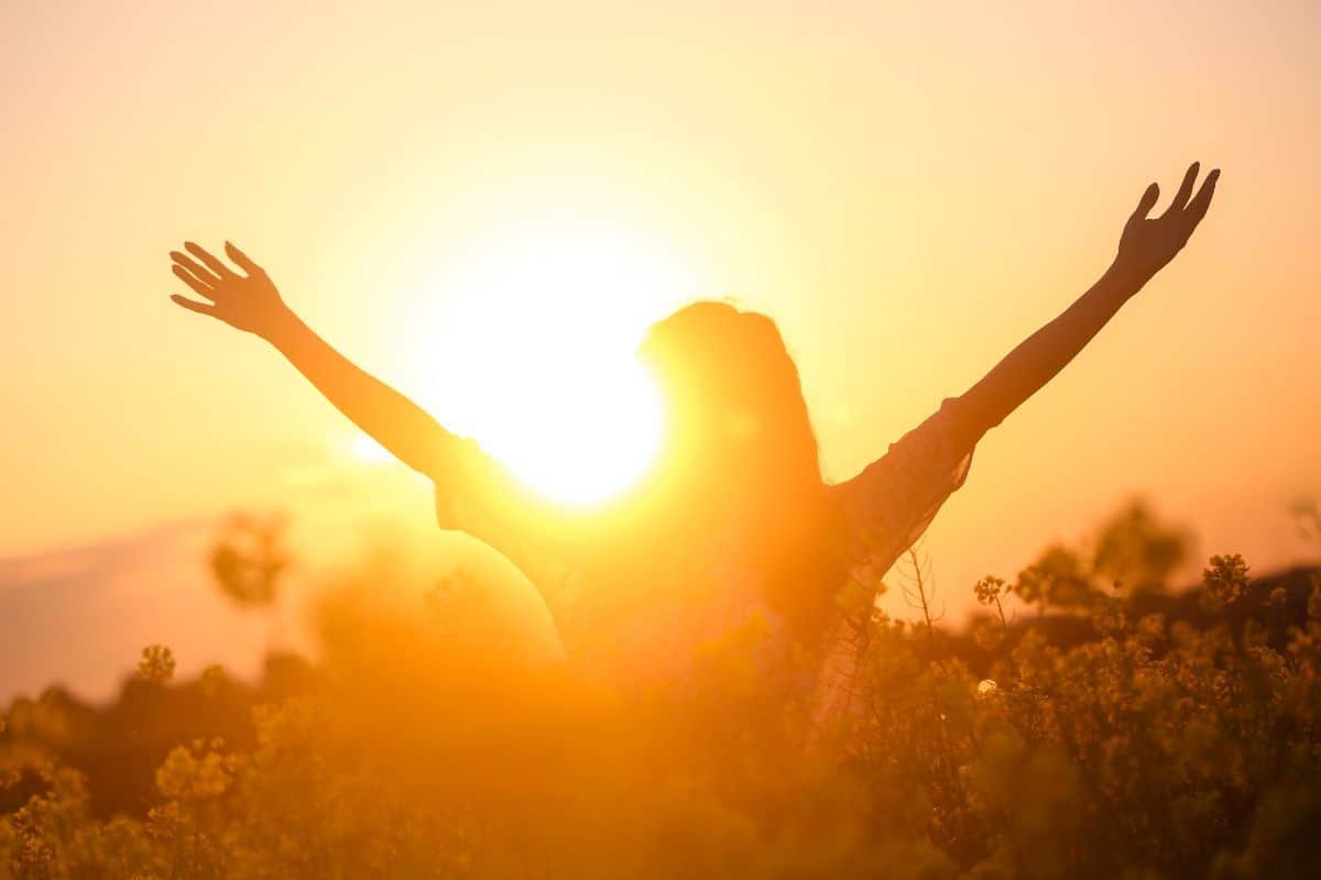 happy woman silhouette in sunshine