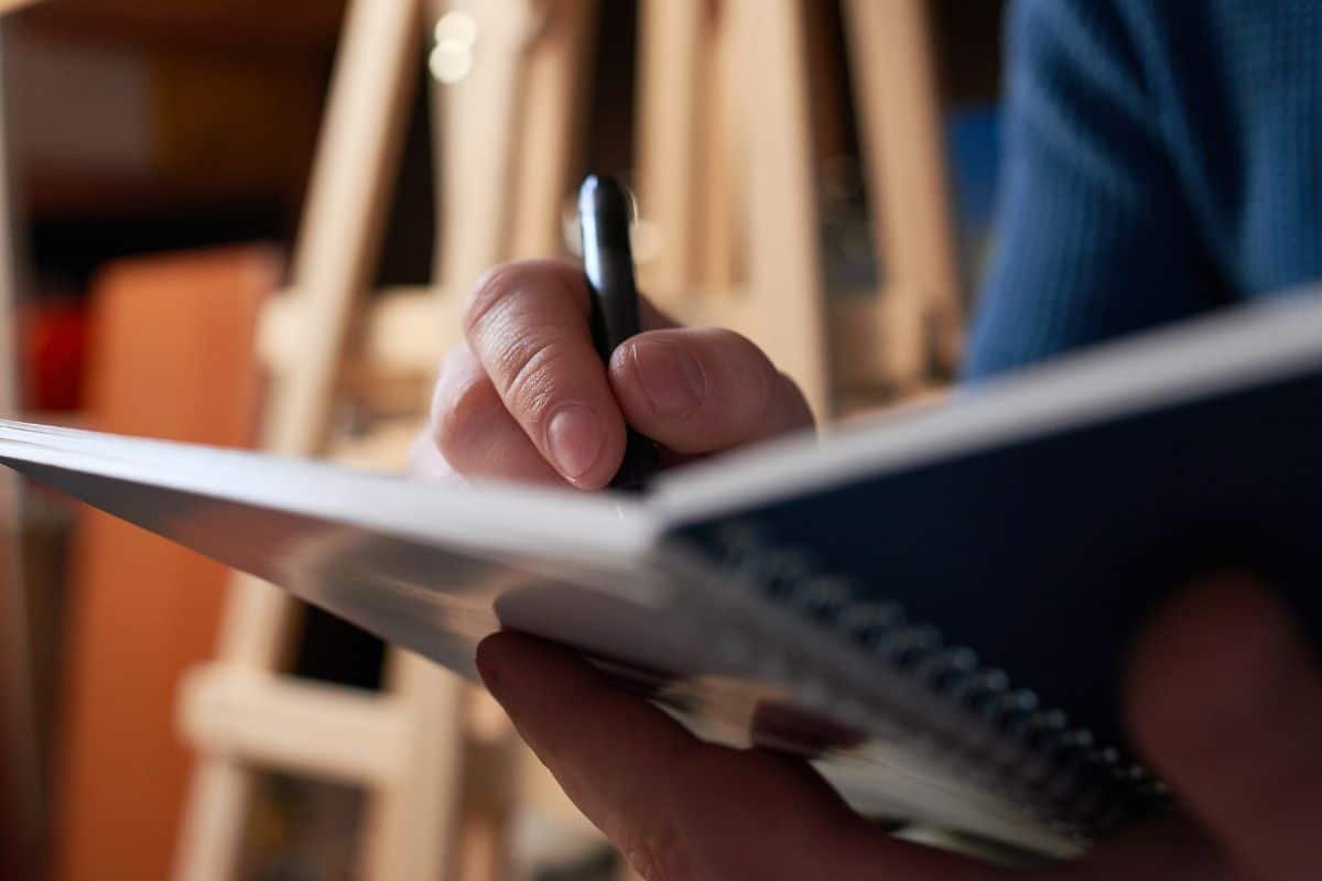 person journaling in a notebook