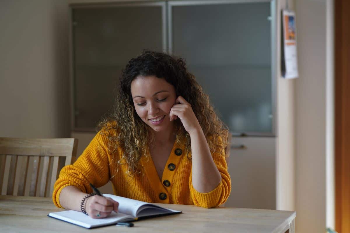 woman writing in a journal